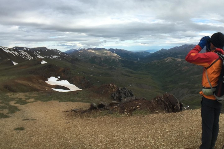 Hiker peering out to the mountains