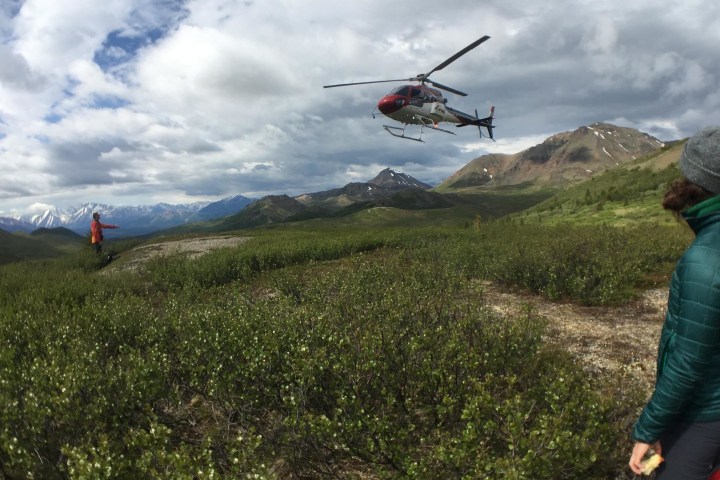 Helicopter in the distance among grand landscapes