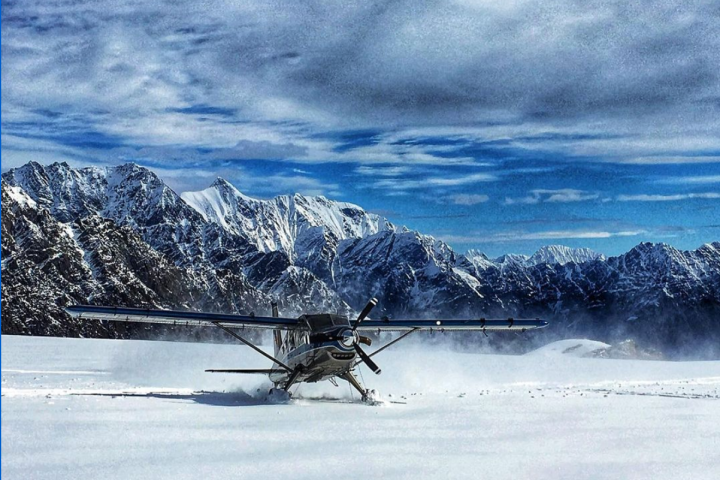 a group of people riding skis on top of a snow covered slope