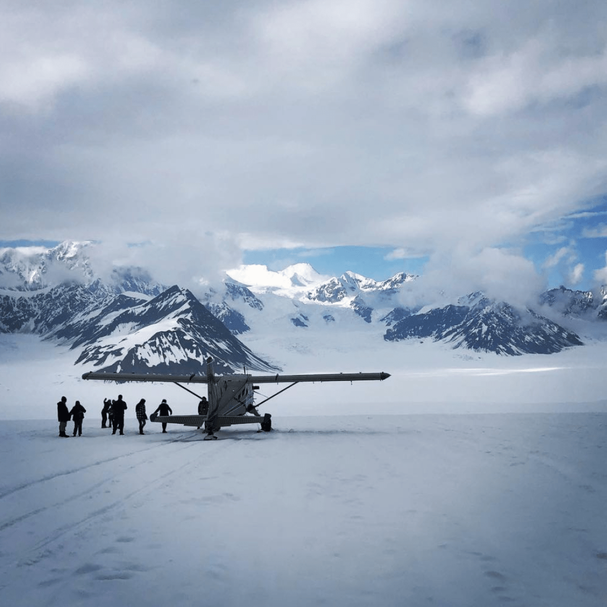 a group of people that are standing in the snow
