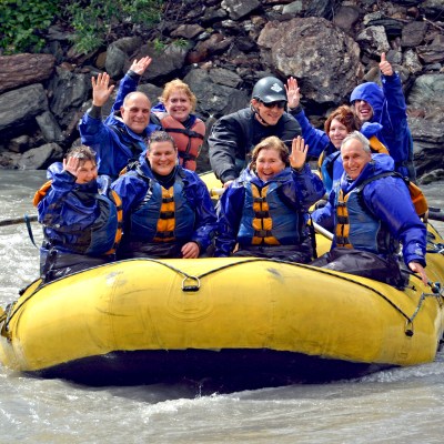 Group on river rafting with oars